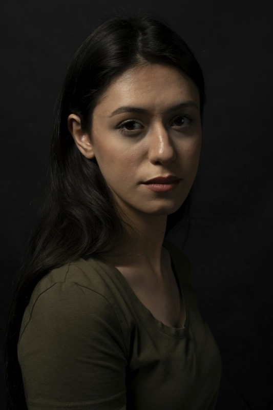 Moody portrait of a woman in a green top
